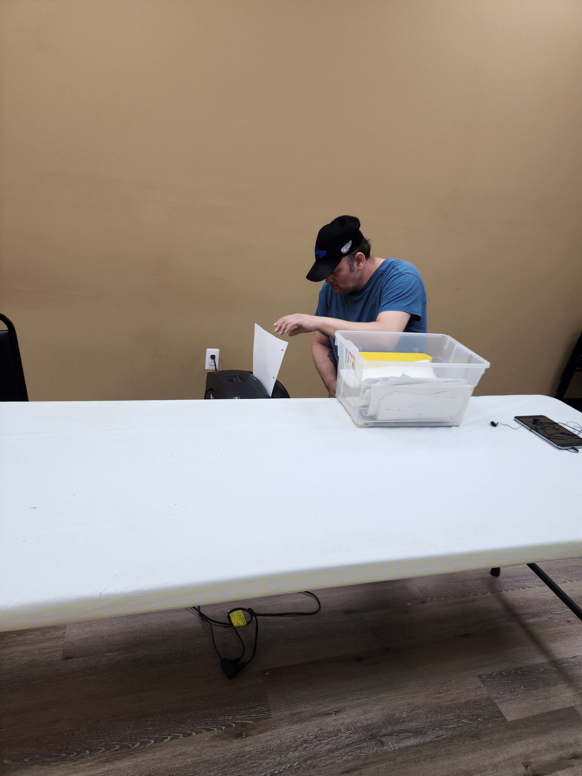 Man Shredding Papers