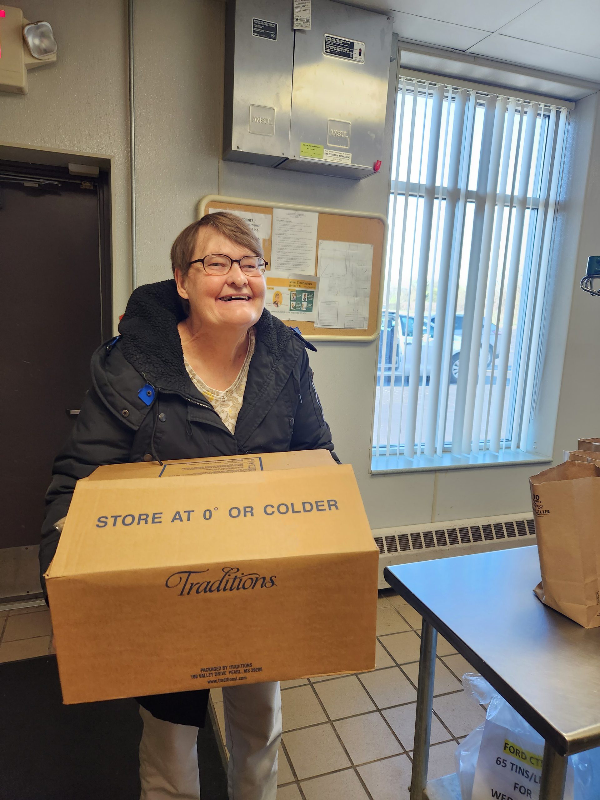 Senior Woman Holding a Box
