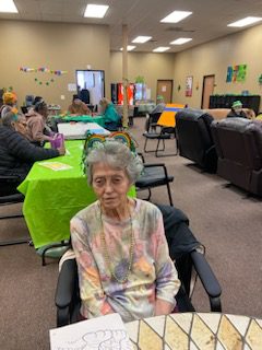 Senior Woman Sitting in Chair