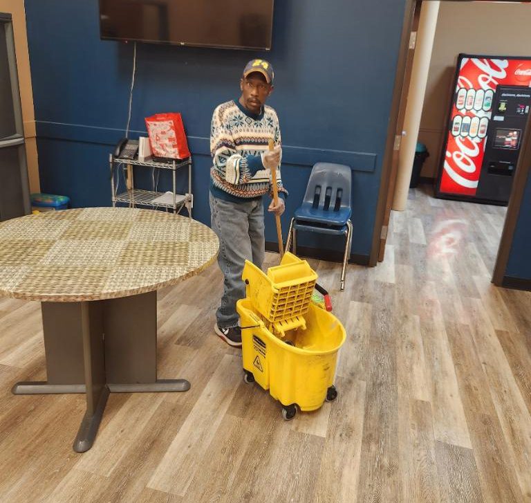 Man Cleaning the Floor